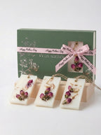 mother's day wax sachet gift set with dried rose buds and floral decorations